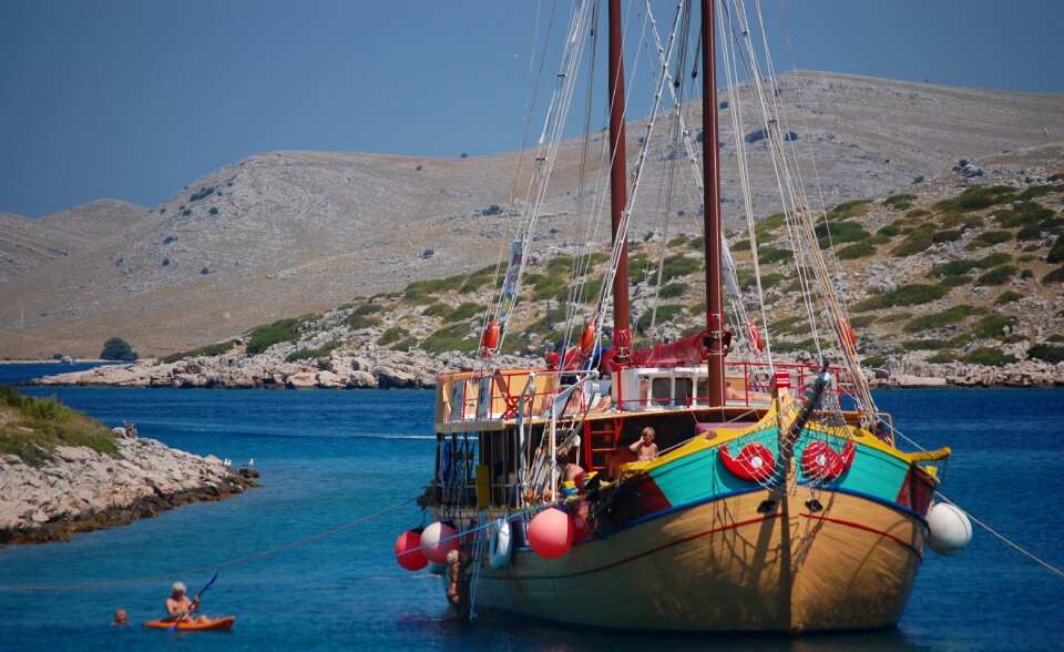 Sailboat sea mountain photo