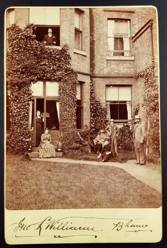 Penny Farthing bicycle in the garden, 1880s? Possibly Birmingham, UK