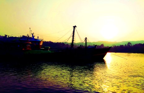 Fishing Ship in Naf River at Sunset