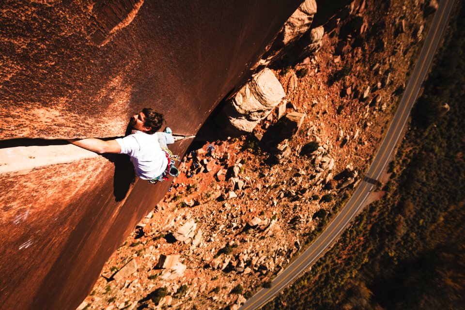 Bowe Ellis nears the top of Super Crack of the Desert, 5.10, Indian Creek, Utah. Photo by Jonathan Jew