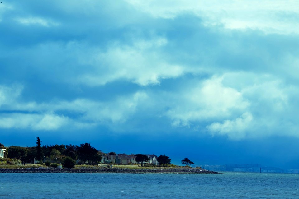 Houses on Peninsula with Clouds