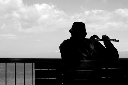 Man flute gray music