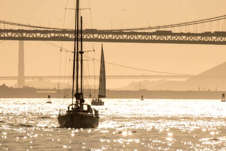 Yacht Sailing the Bay in the Evening photo