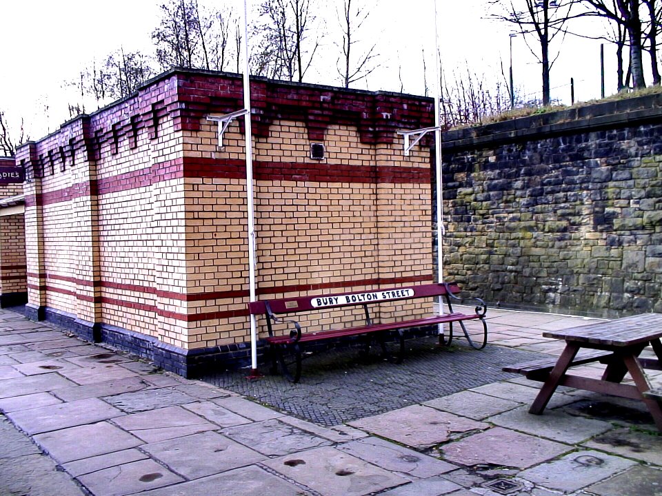 Bury Bolton Street original station seat and the decorative brickwork of the toilet block