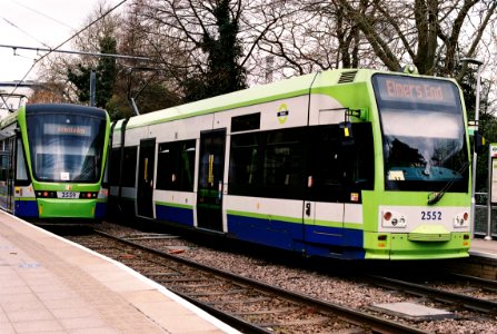 Two classes of Croydon trams pass at Wandle Park