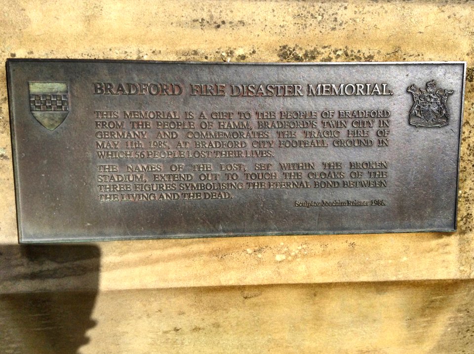 Plaque behind the Bradford City stadium fire memorial