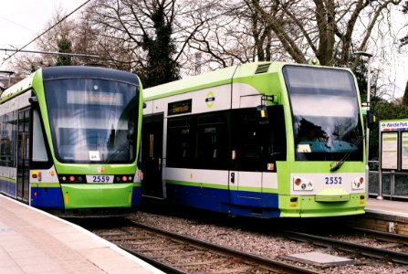 Two classes of Croydon trams pass at Wandle Park