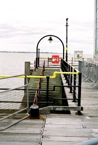 Ramp down to boats at Southend pier. Disused? photo