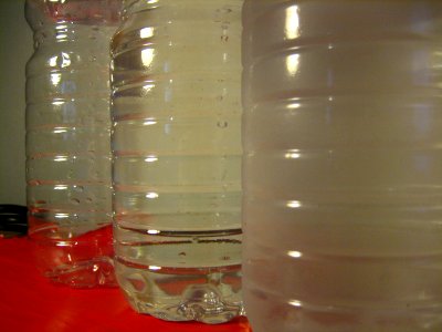 Plastic PET Water Bottles: Empty, Full, Cold photo