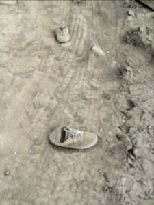 Found Item Mud Sneakers photo