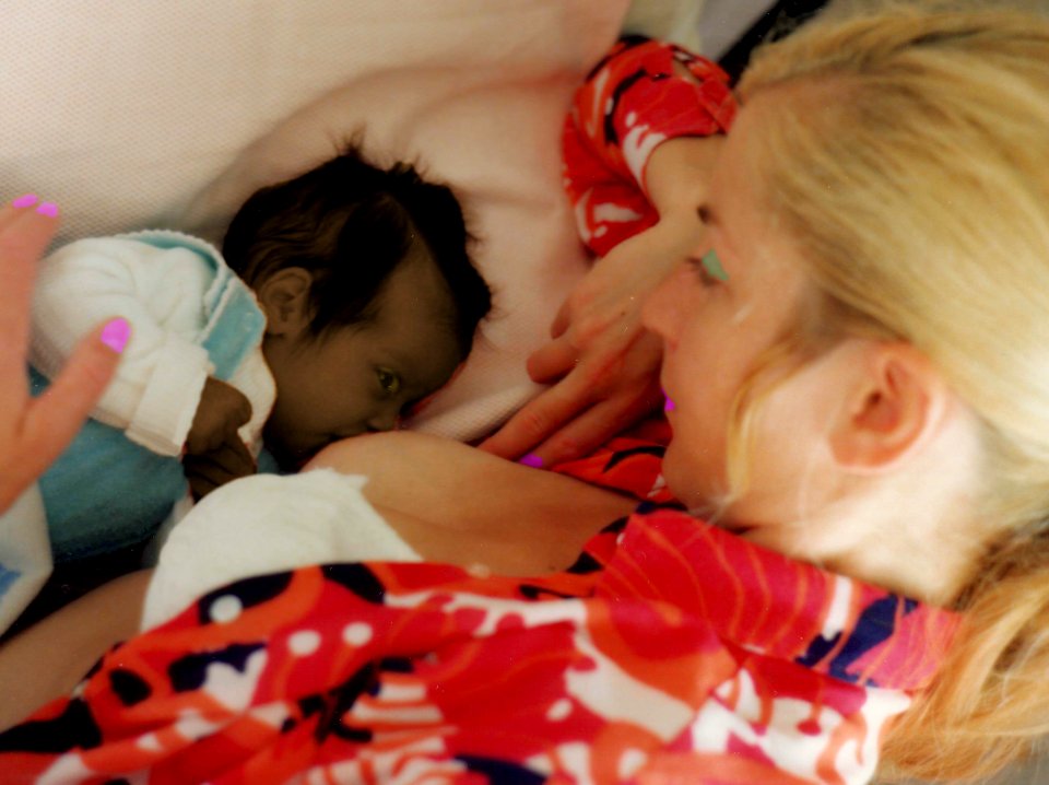 Andrea feeds baby