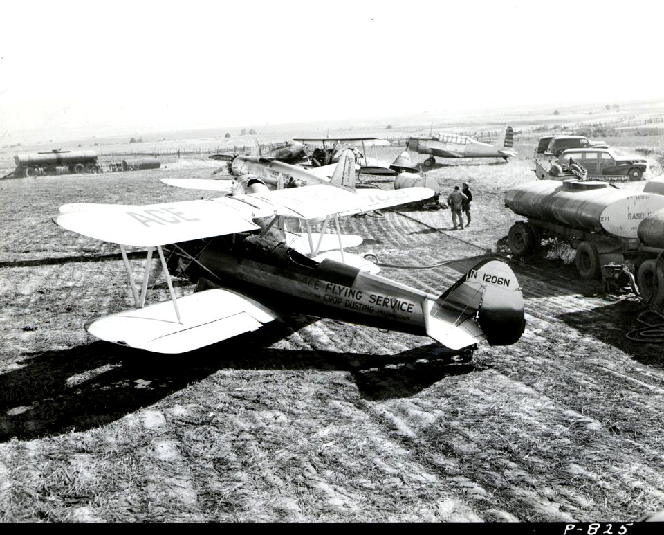 1949. Stearmans and BTs in spray loading area. Western spruce budworm control project. Mt. Hood area, Oregon.
