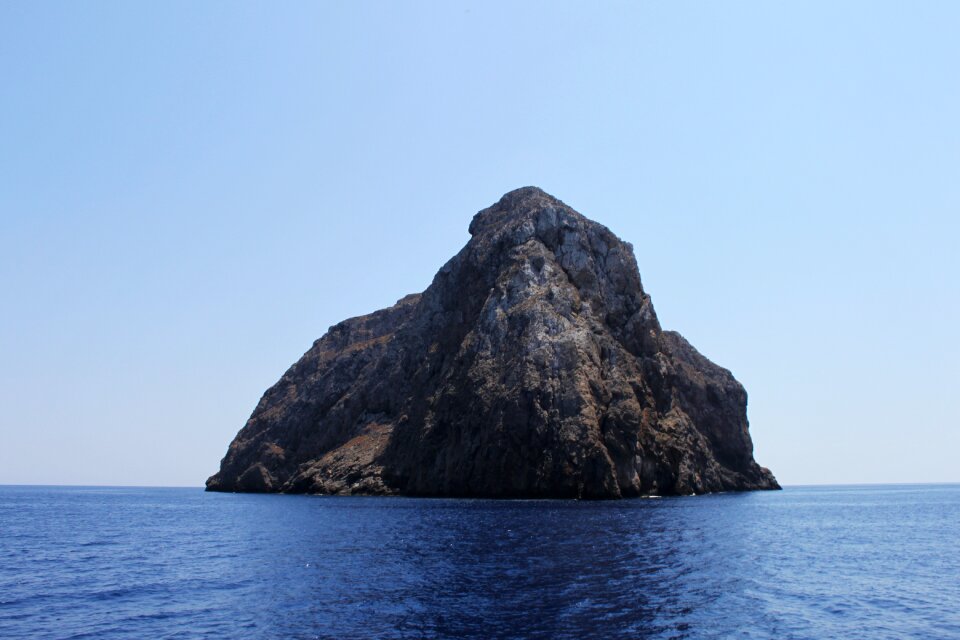 Sheer face steep blue rock