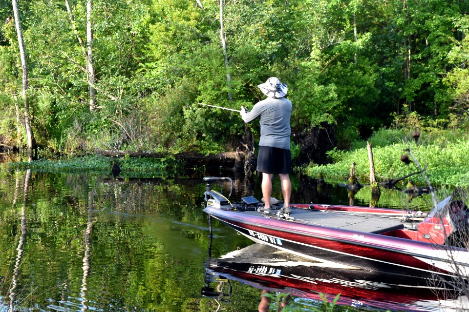 person fishing Scuppernong Interpretive Boardwalk ncwetlands am
