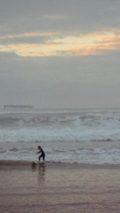 a young boy surfing photo