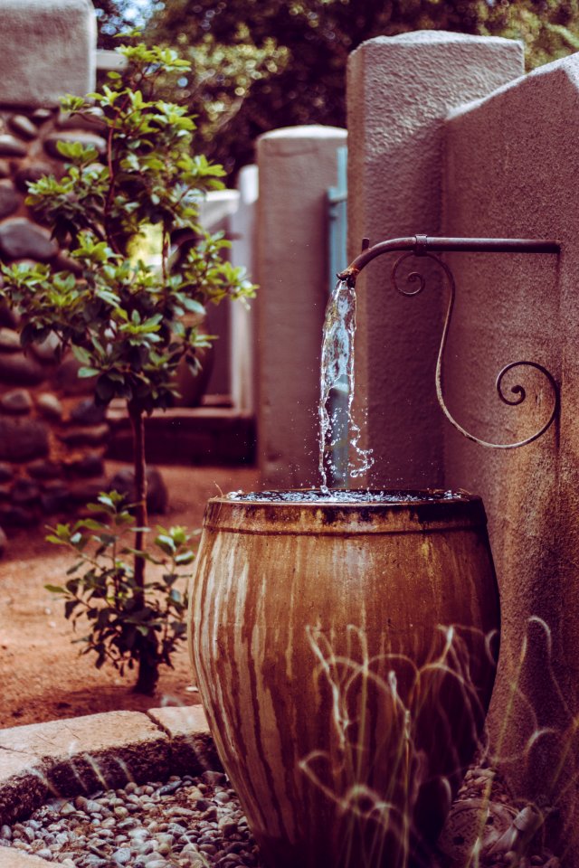 Water Draining Into Large Pot