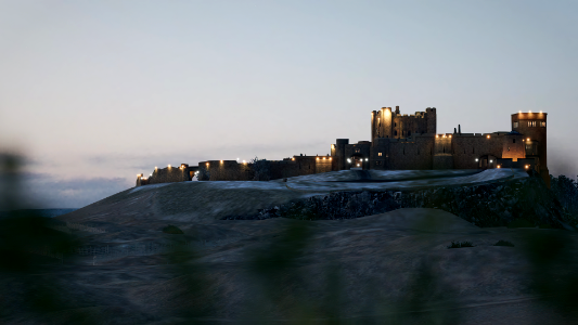 [HIGH RES] Bamburgh Castle through the grass in the distant.