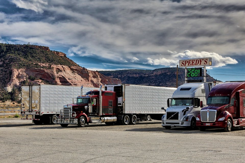 Semi Truck and Trailers at a Gas Station Entering the Mountains of New Mexico photo