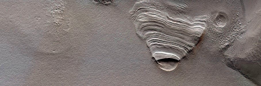 Mars - Layered Structure and Depression on Rim of Moreux Crater photo