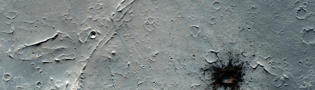 Mars - Small Dark Crater in North Tharsis Region photo