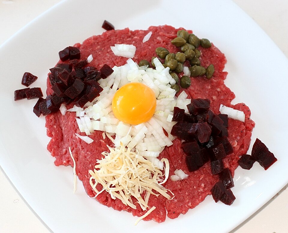 Raw egg yolk capers peberros