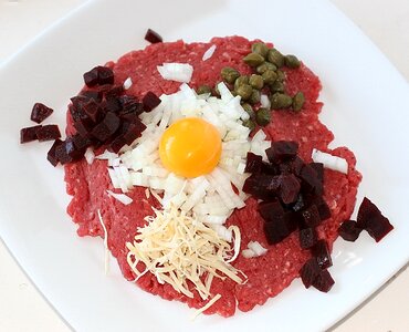 Raw egg yolk capers peberros