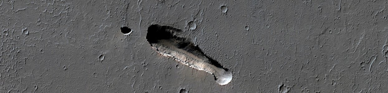 Mars - Elongated Collapse Pit in Ceraunius Fossae photo