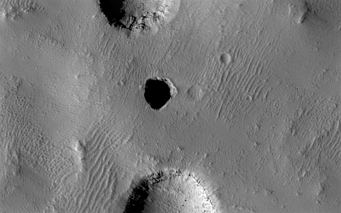 Mars - Incipient Pit Crater in the Arsia Chasmata photo