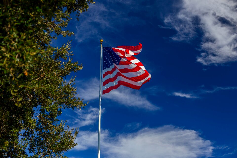Flag pole sunny day patriotic