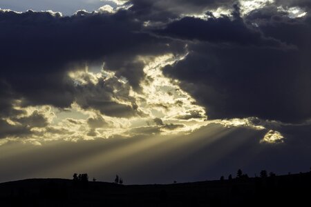 Clouds crepuscular rays silhouettes