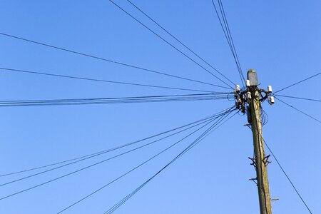 Old step irons overhead cables blue sky photo
