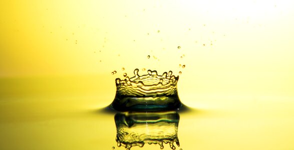 Liquid close up golden drops photo