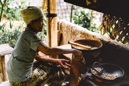 Old woman brown cooking