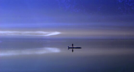 Ship mirroring boat photo