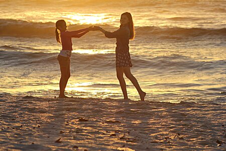 Dance sunset holding hands
