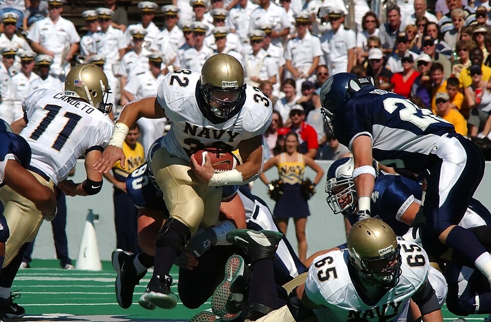 Running back ball carrier american football field