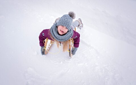 Girl toboggan slide photo