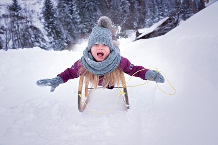 Girl toboggan slide photo