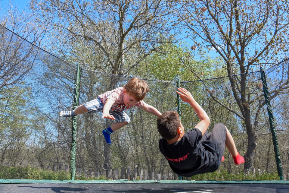 Outdoor jumping kids playing photo