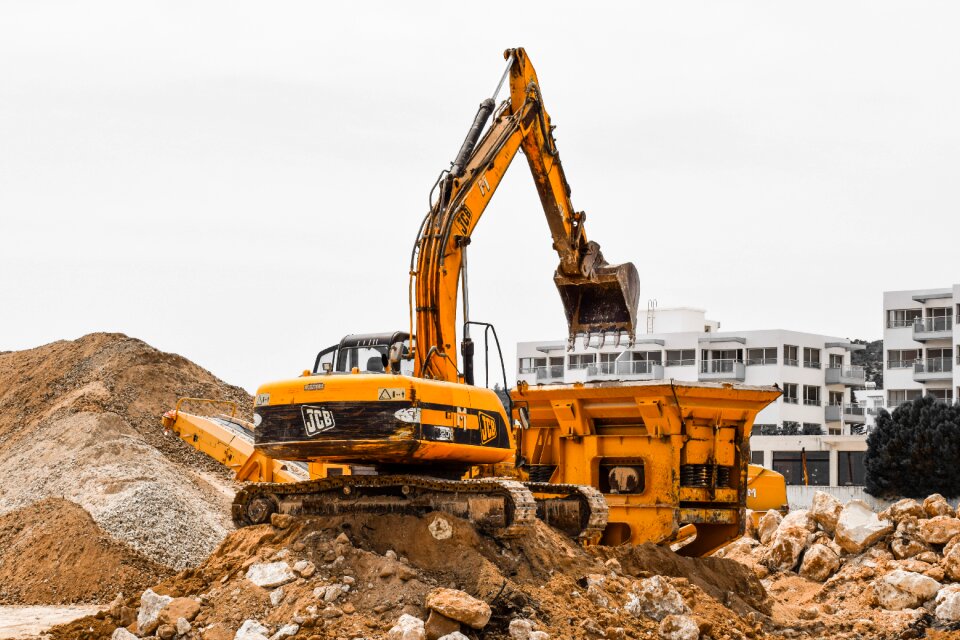 Yellow excavator crusher