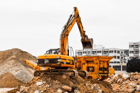 Yellow excavator crusher