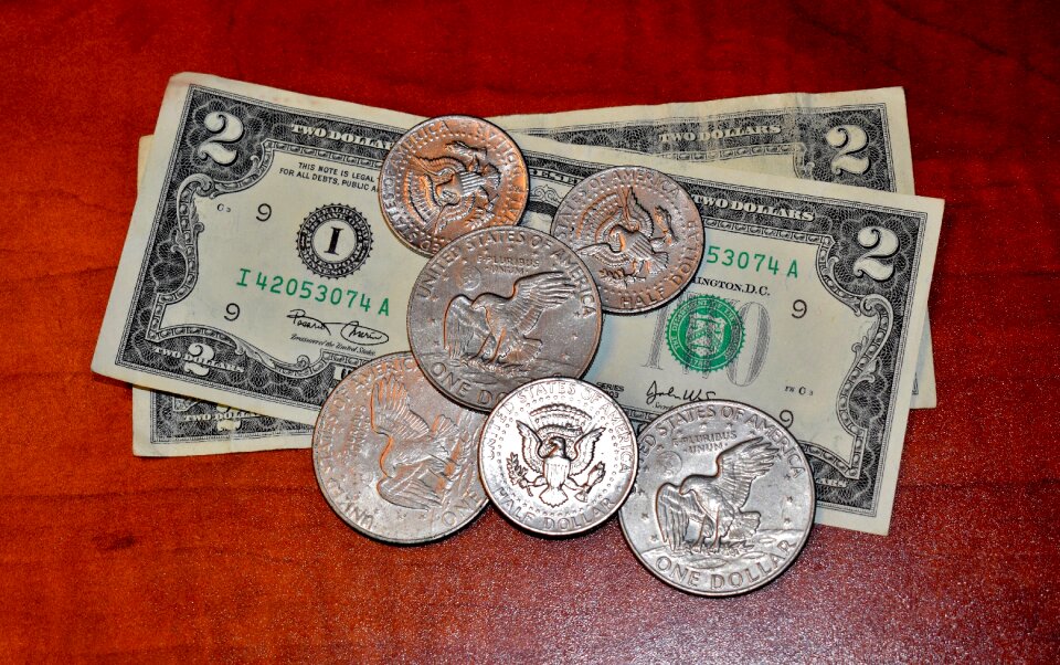 Two dollar bill half dollar dollar coin