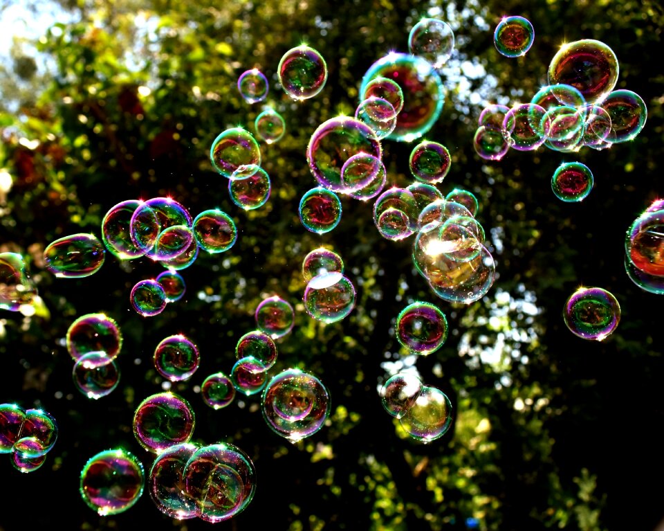 Make soap bubbles mirroring soapy water