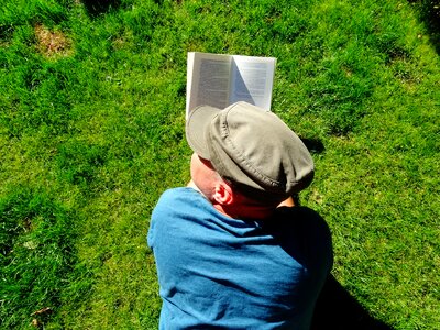 Hat books grass photo