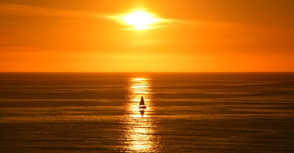 Sail boat sun horizon photo
