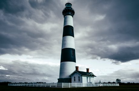 grayscale photography of light house photo