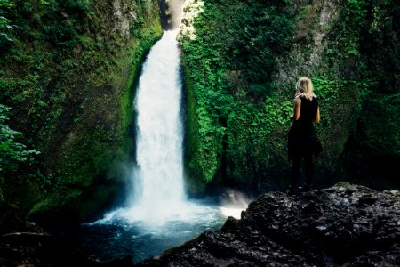 woman in front of waterfalls photo