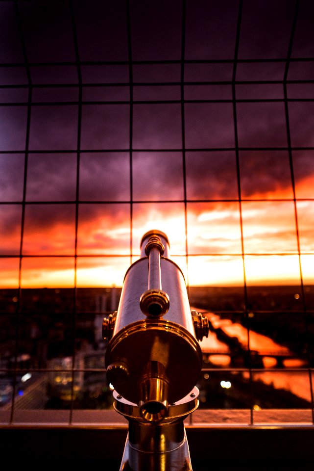 gray and yellow telescope against grill