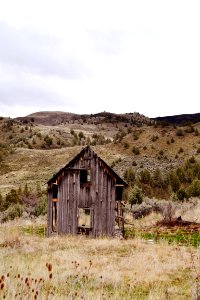 brown wooden shed on mountain photo