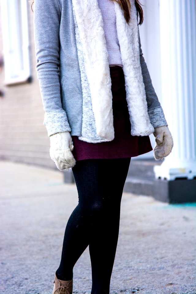 woman wearing gray and white fur coat standing